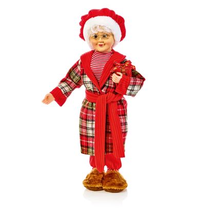 premier-mrs-claus-in-pyjamas-with-present